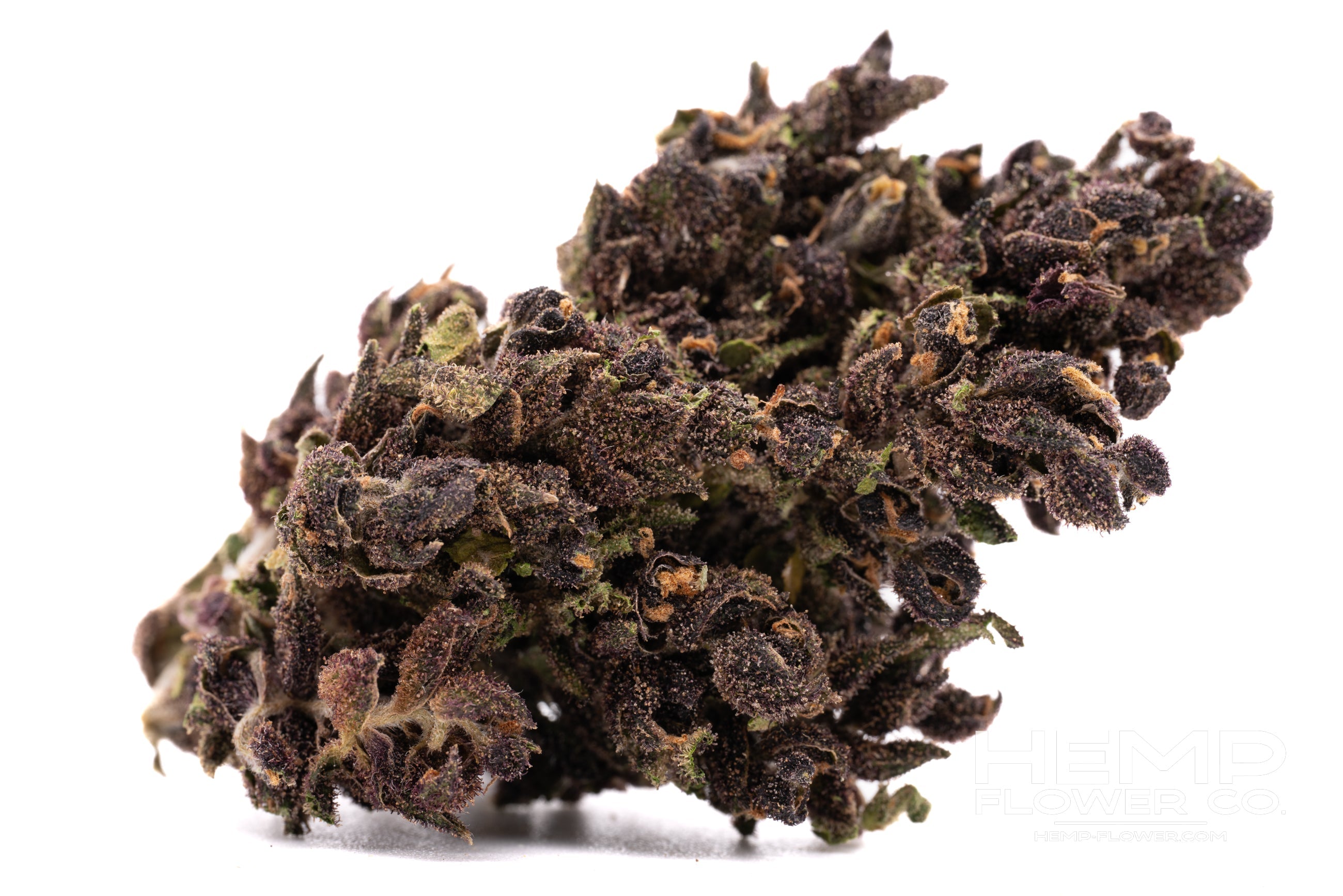Dark purple and green cannabis bud covered in trichomes for After Dark Indoor THCa Flower Wholesale