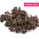 Dense dark purple dark indoor THCA cannabis bud with trichomes for wholesale customers