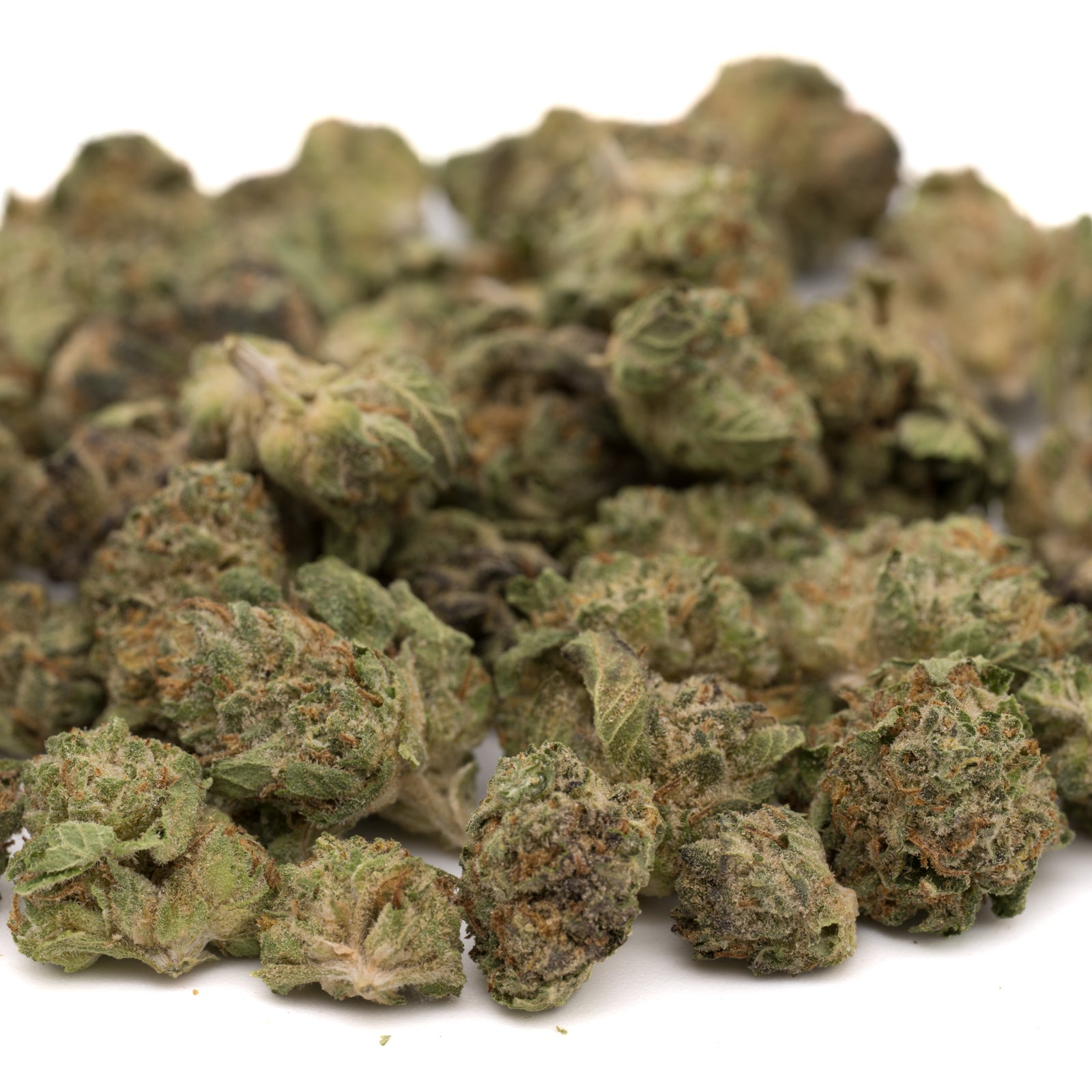 Light green and brown cannabis buds from After Dark THCa Hemp Flower greenhouse wholesale