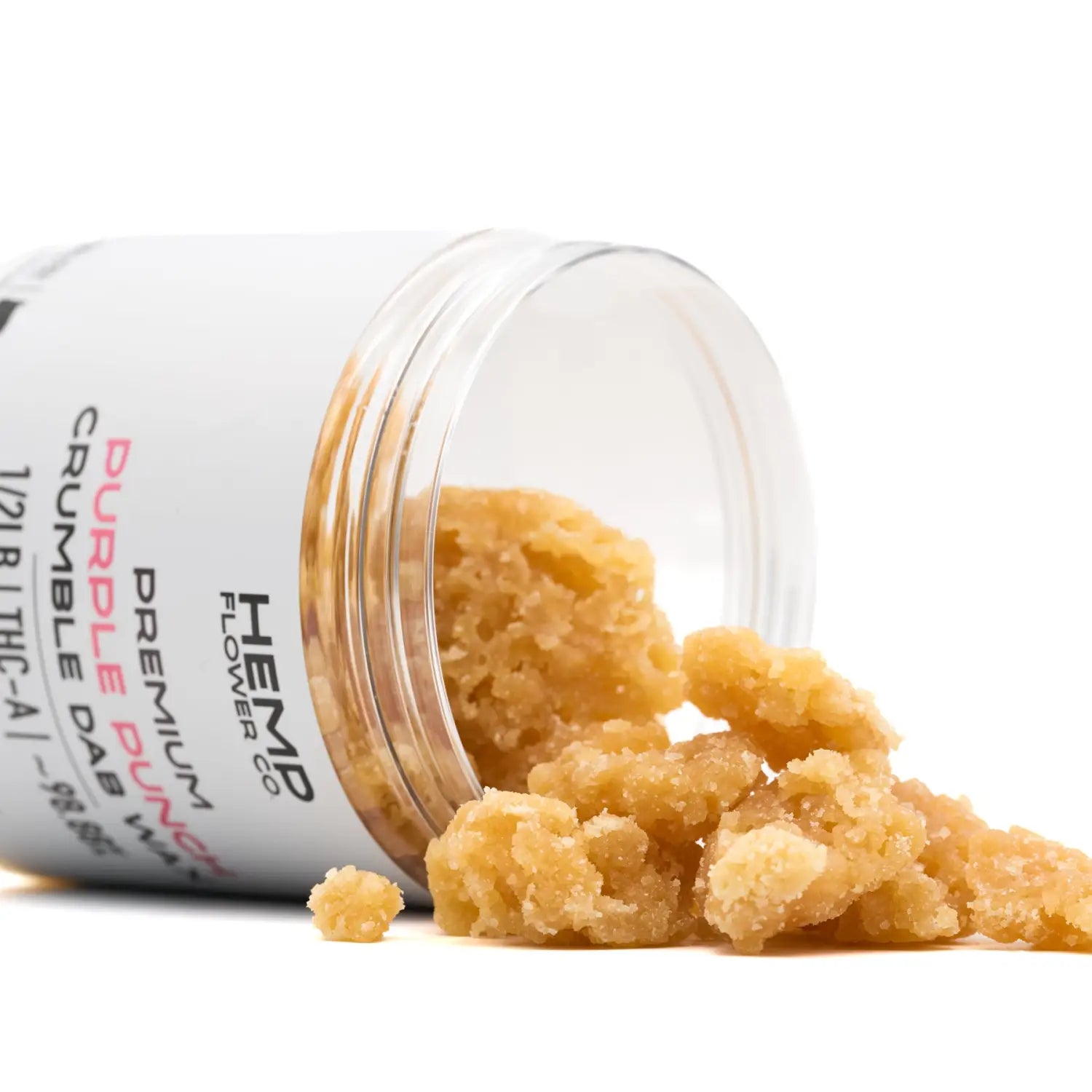 Amber-colored cannabis crumble spilling from a jar, showcasing THCA crumble wax purity