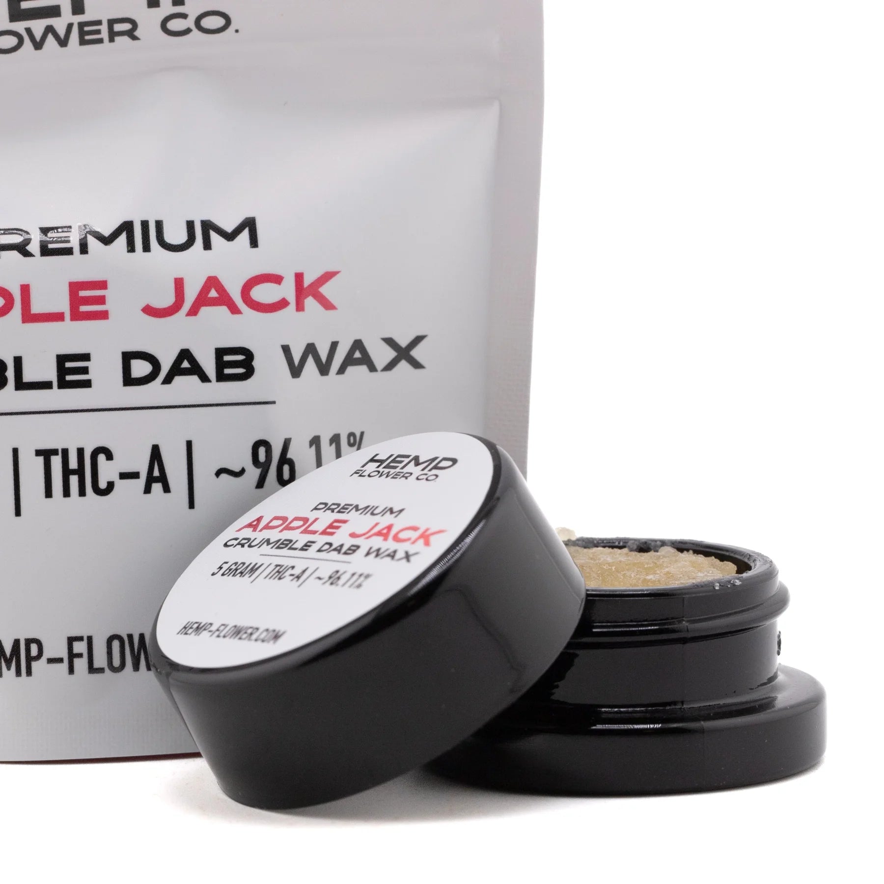 Black cylindrical container with white label holding 5 gram apple jack thca crumble wax hemp flower product