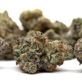 Astroboy Indoor THCa Flower with orchard swirl cannabis buds, orange hairs, and frosty trichomes