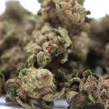 Lush dense bahama bussdown thca small hemp flower buds with frosty green and brown hues in greenhouse smalls style