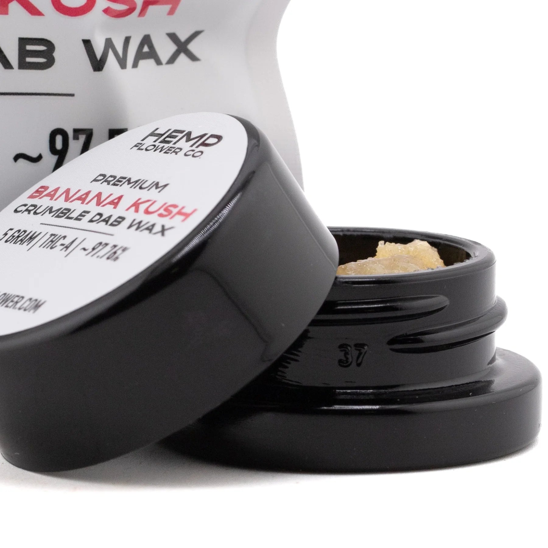 Black ceramic jar containing light amber banana kush thca crumble wax derived from hemp flower 5 gram jar