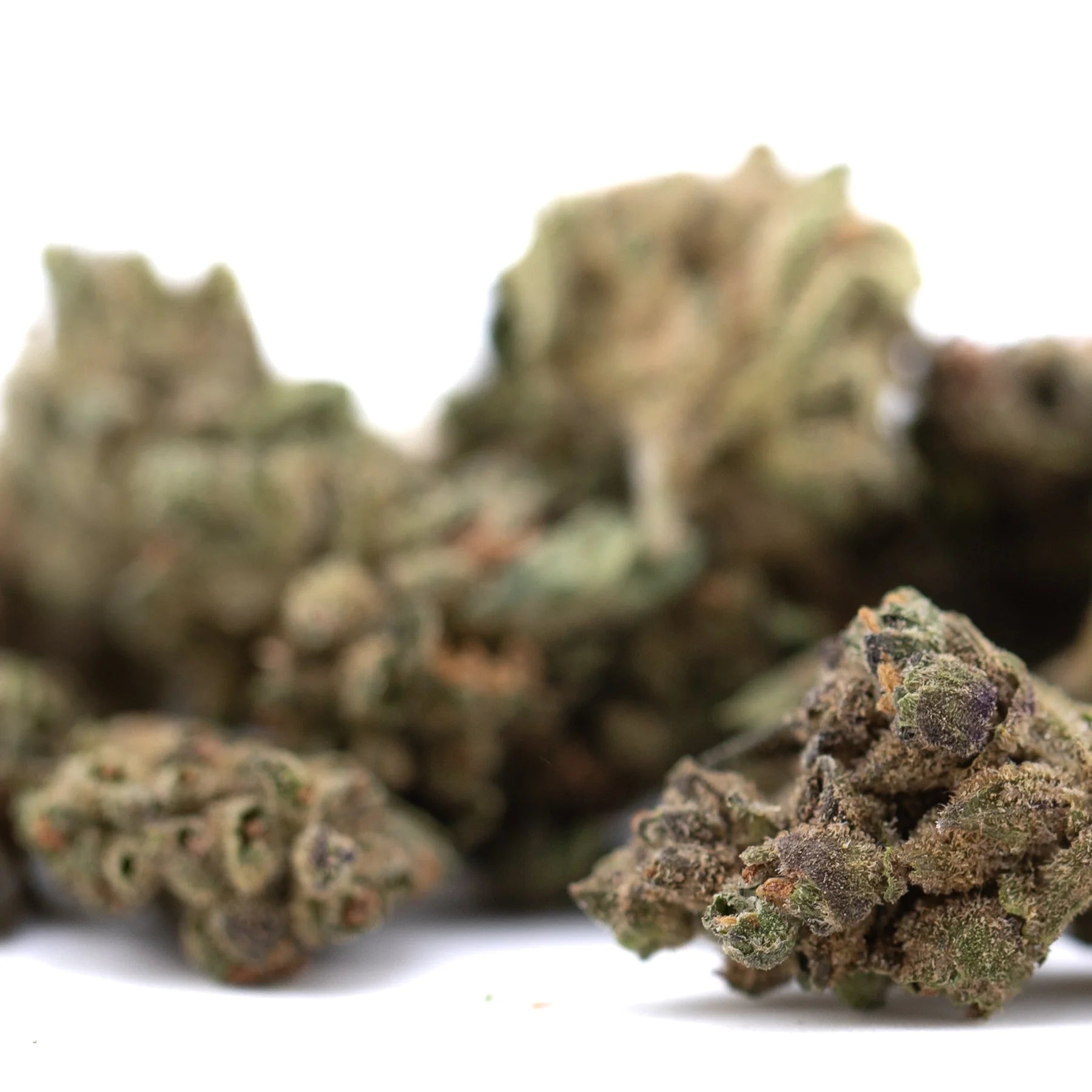 Green and purple banana og’s full-term thca hemp flower smalls with a frosty textured surface