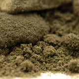 A mound of finely ground green thca kief with a tropical character from legendary banana og full-term wholesale