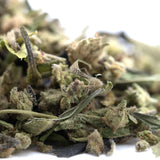 Dried banjerine trim cannabis buds with green and brown hues covered in fine trichomes for paradoxical citrus use