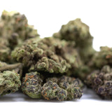 Banjerine thca flower smalls full-term wholesale showing dense green and purple ultra-premium citrus indica buds