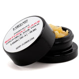 Black cylindrical container with white label holding yellow birthday cake thca crumble wax 5 gram for hemp flower use