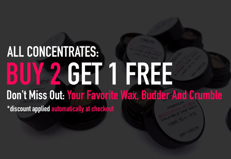 Black circular containers with white labels displaying ’premium crumble dab wax’ and other text, arranged in a pile.