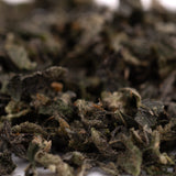 Dried dark green loose leaf tea with brown specks for Blue Heron Indoor Trim Wholesale 1LB