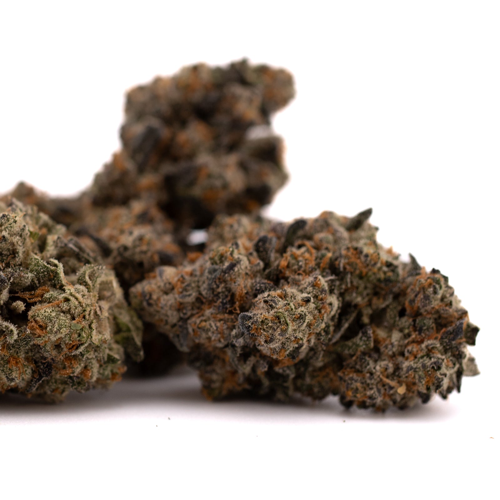 Blue Heron THCa Flower with dried cannabis buds, trichomes, and orange pistils