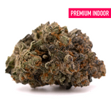 Blue Heron THCa Flower showcasing dense cannabis bud with trichomes and orange hairs