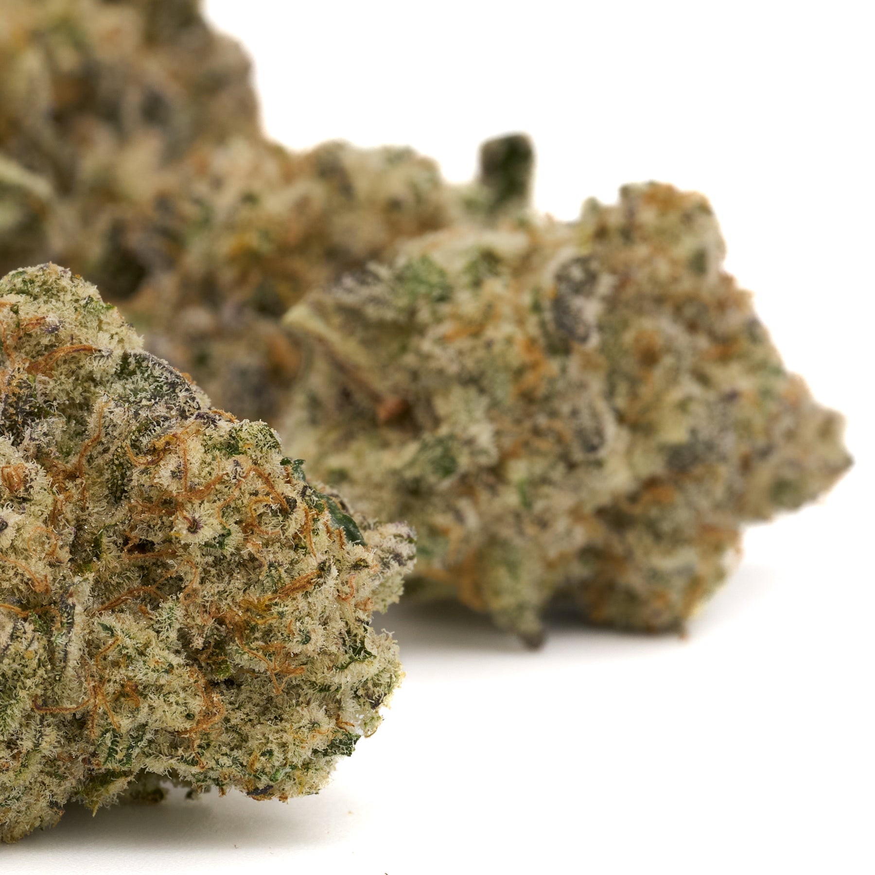 Blue Muffin Indoor THCa Flower with cannabis buds, trichomes, and orange hairs