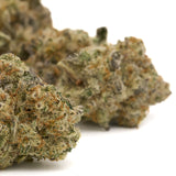 Blue Muffin Indoor THCa Flower with cannabis buds, trichomes, and orange hairs