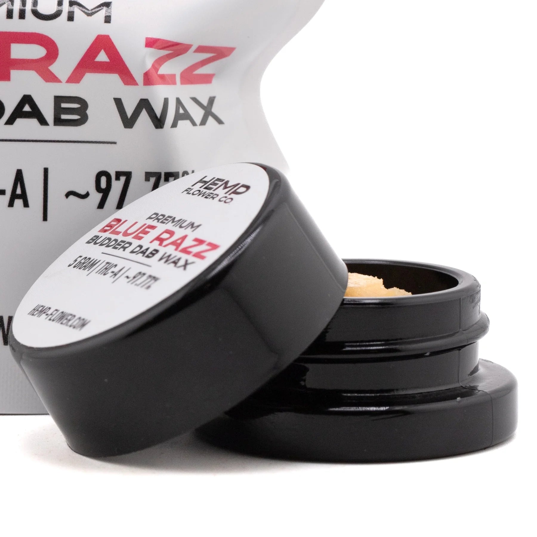 Black plastic jar with white label containing premium blue raz thca budder wax 5 gram for concentrate use