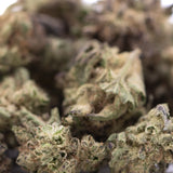 Blue sugar thc hemp flower greenhouse smalls with dense green bud frosty trichomes and purple sugar cookies hints