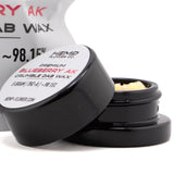 Black cylindrical container of blueberry ak thca crumble wax with yellowish crumble and kush-like flavor label