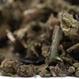 A pile of blueberry muffin thca trim hemp flower buds with green and brown hues and dense trichomes for wholesale use