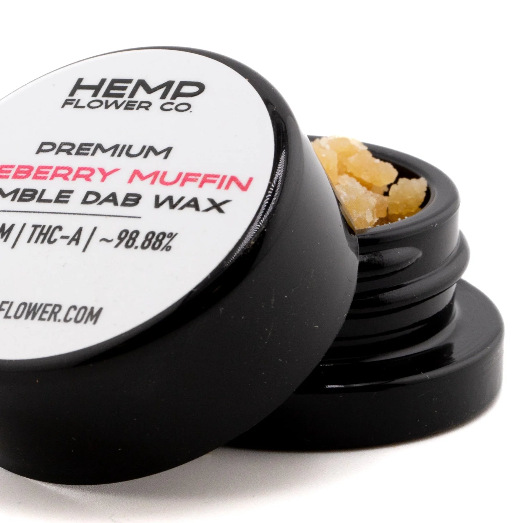 Black cylindrical container of hemp flower premium ryeberry muffin dab wax with amber blueberry muffin thca crumble wax