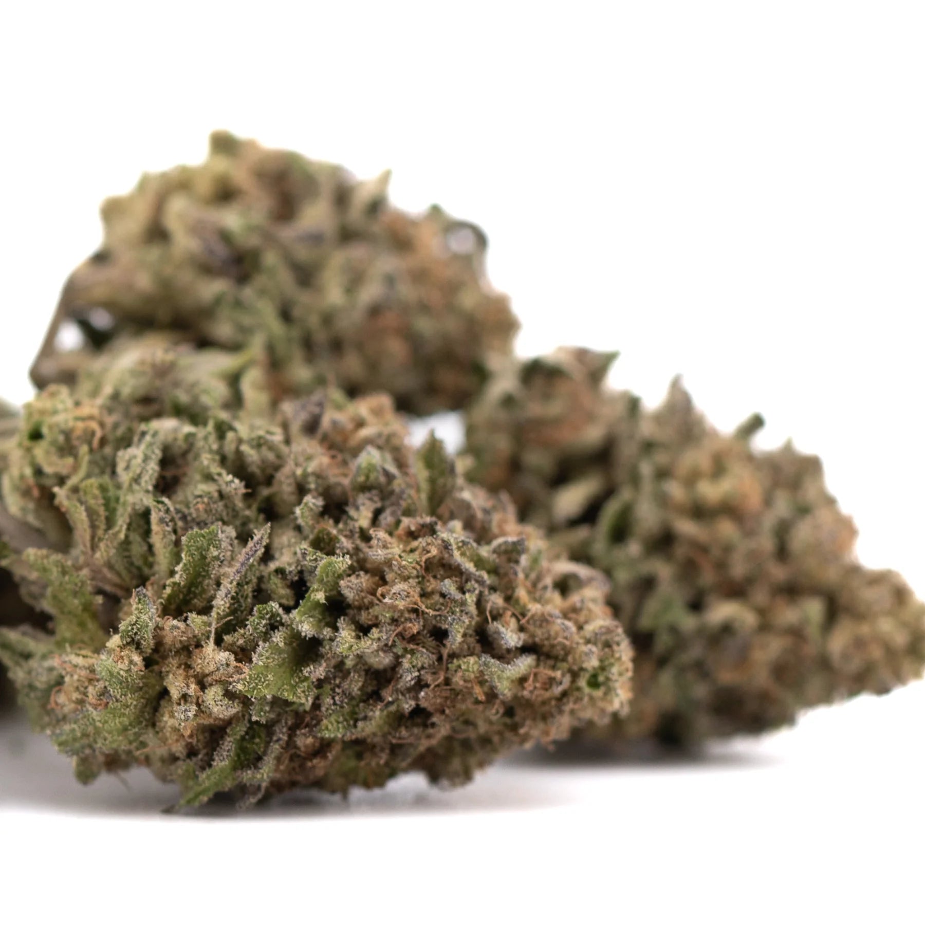 Mature bolor tartz greenhouse thca hemp flower buds with dense textured surface covered in green and brown trichomes