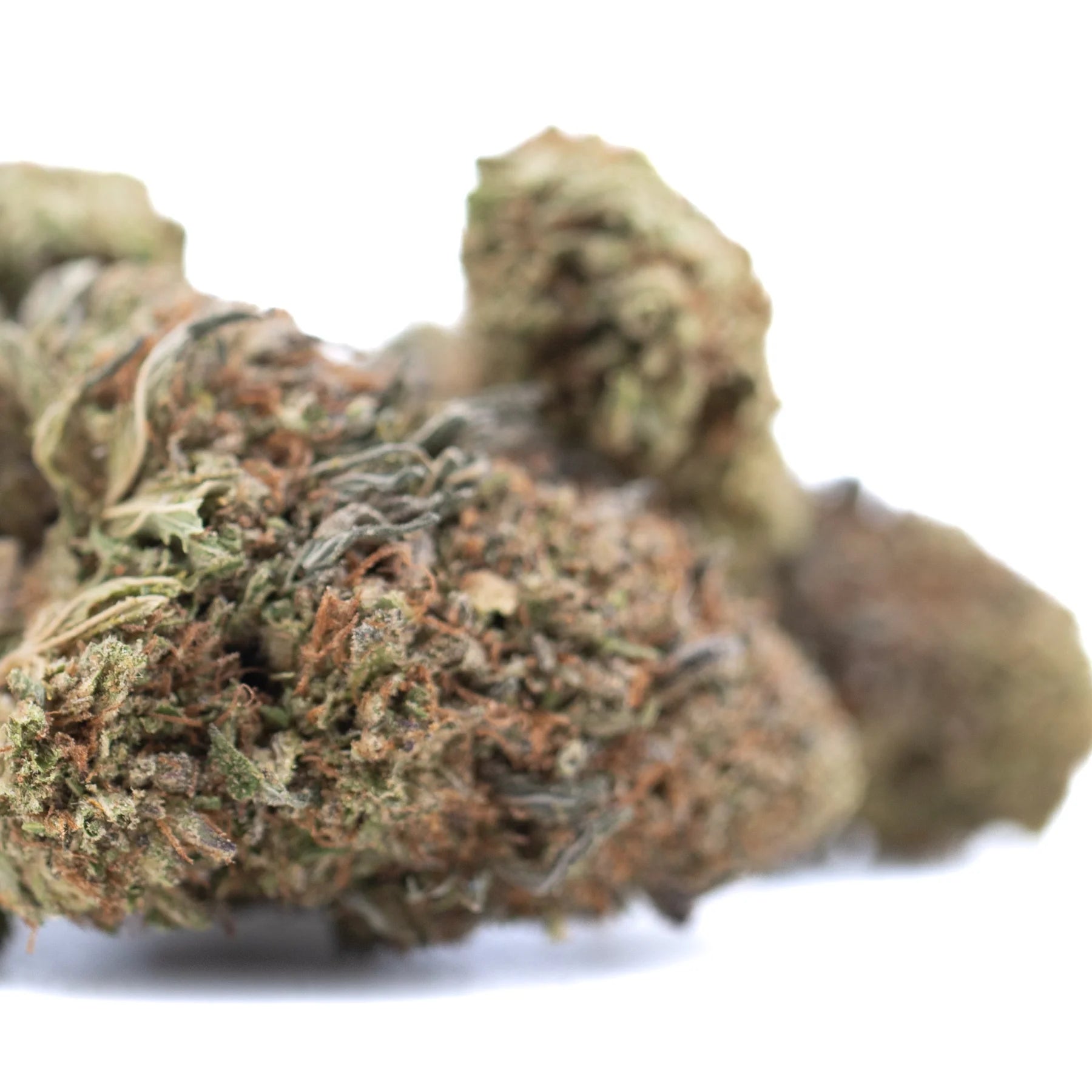 Dense green and brown bubba kush cbd hemp flower bud showing trichomes highlighting cannabinoid potency and flavor profile