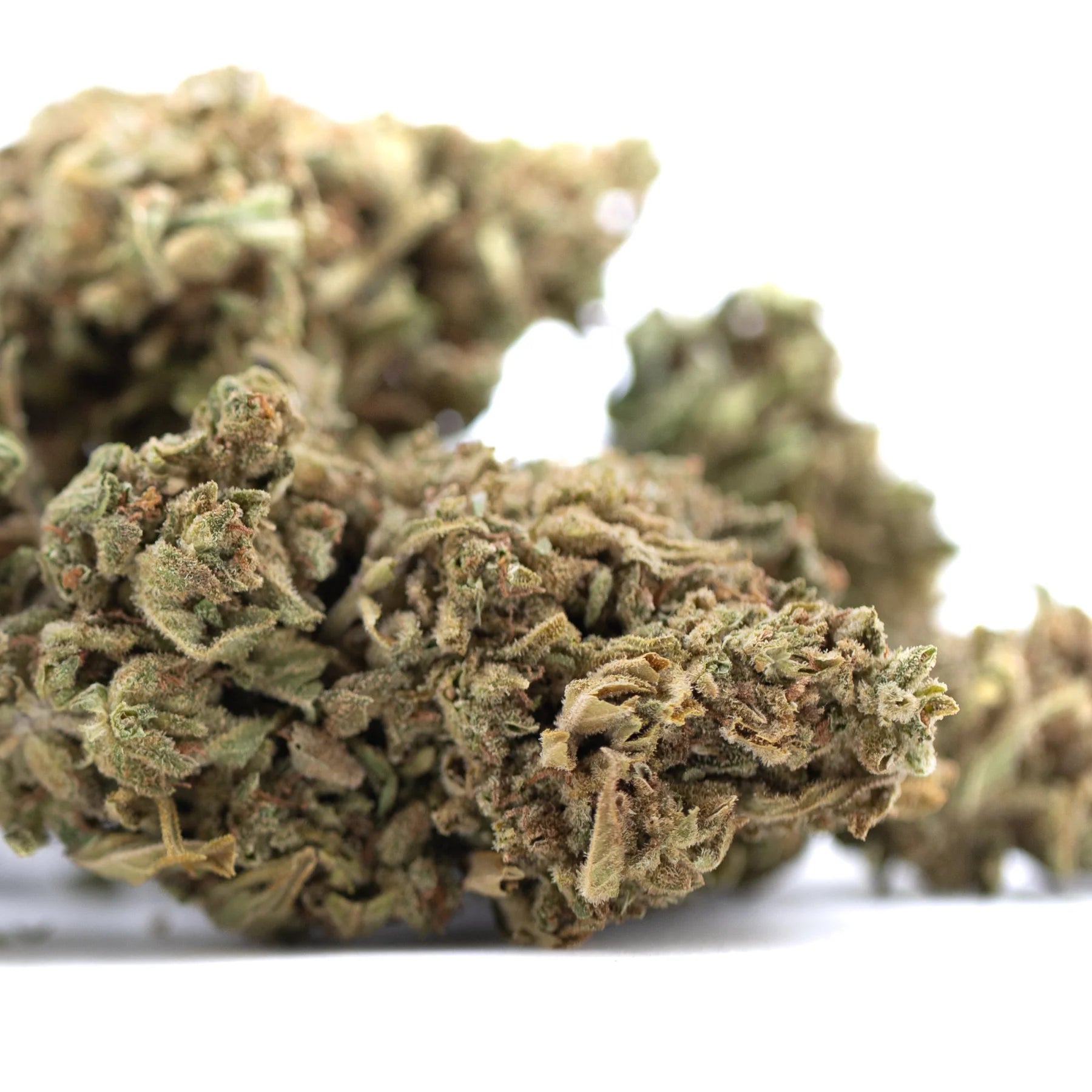 Dried bubba kush cbd hemp flower buds with dense textured appearance in shades of green and brown kush full-term