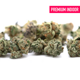 Pile of Butter OG Indoor THCa Flower Smalls with green and orange hues and trichomes