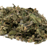 Pile of dried green herbs from Cadillac Rainbow THCa Indoor Trim Wholesale 1LB
