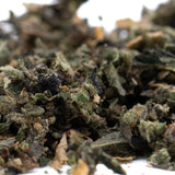 Close-up of finely ground Butter OG Indoor THCA Trim for Wholesale 1LB products