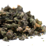 Dried green and light brown herbs from Butter OG Indoor Thca Trim Wholesale 1lb