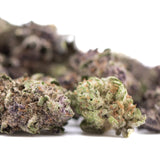 Lush dense cali burger thca hemp flower greenhouse smalls with vibrant green buds and purple orange trichomes