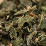 Dried green herbs from Candy Mac THCa Indoor Trim Wholesale 1LB for premium use