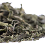 Dried sage leaves in shades of green and gray with a textured surface from candy pave greenhouse thca trim wholesale