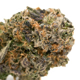 Dense cannabis bud with trichomes and vibrant hues, labeled PREMIUM INDOOR THCA FLOWER