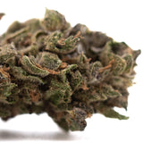 Dense green cbg flower bud with fine trichomes and brownish orange pistils perfect for cbg wholesale and pre rolls