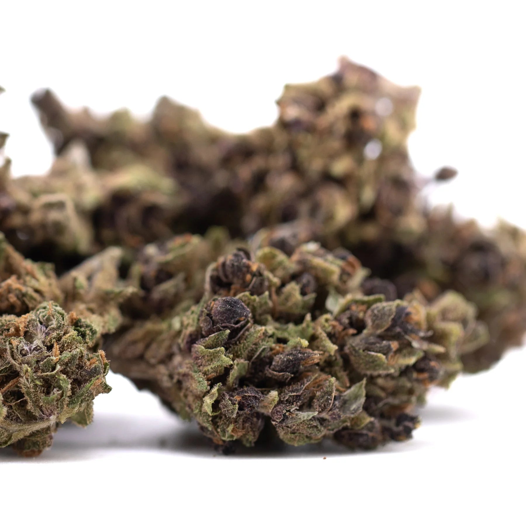 Dried cbg flower hemp buds with dense textured surface in green and brown hues for cbg wholesale and pre rolls