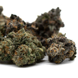 Dried cannabis buds with green purple and orange hues from Chunky Monkey Indoor THCa Flower