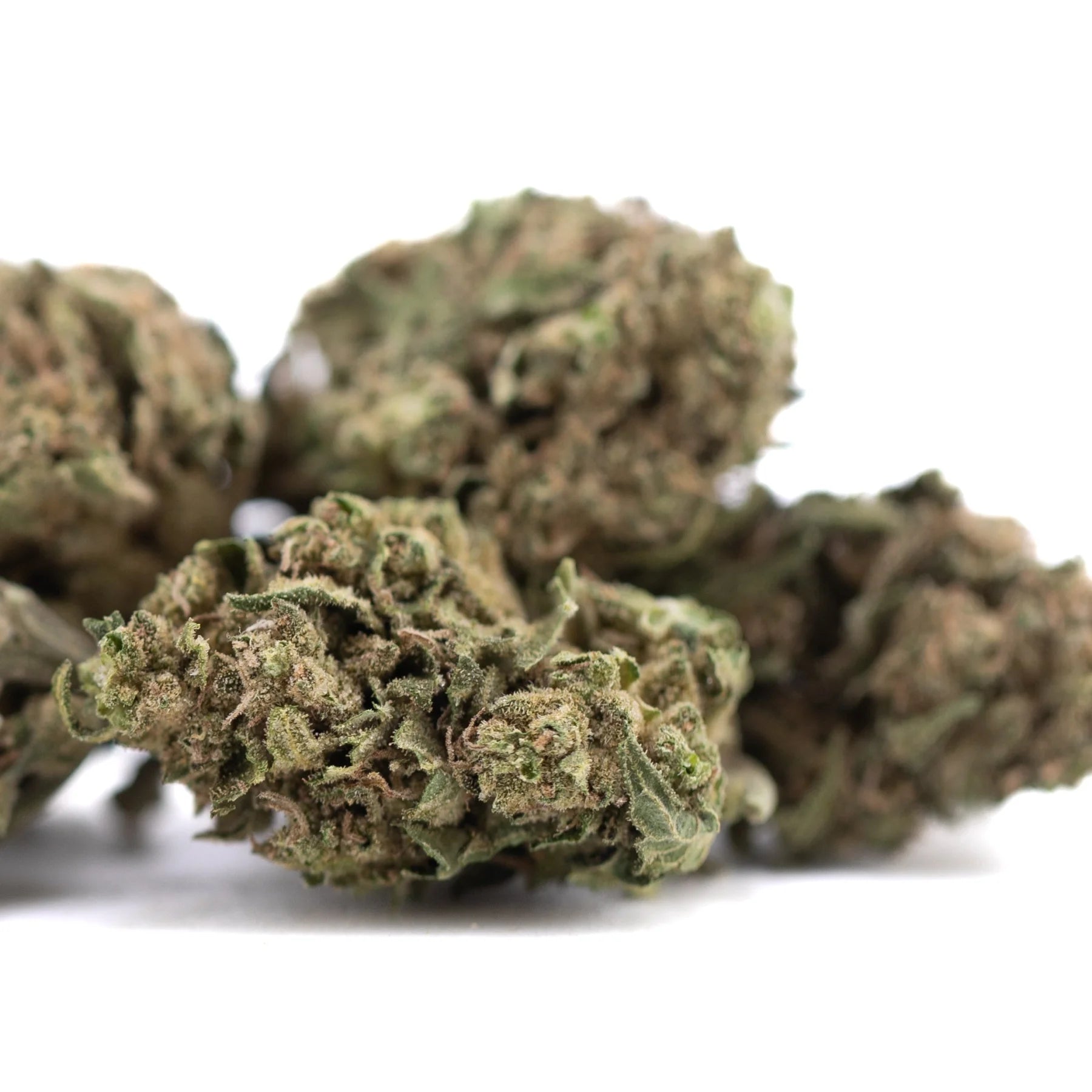 Dried cola full-term thca cannabis buds with dense textured appearance in shades of green and brown for wholesale use