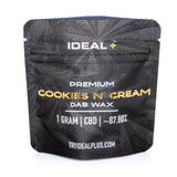 Black resealable pouch with gold foil lettering and subtle cannabis leaf pattern labeled ideal plus premium cookies and cream cbd dab wax