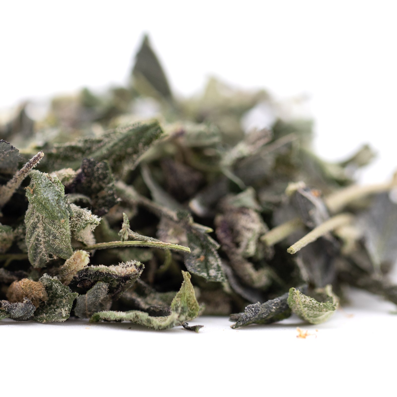 Cookies and Cream THCa Trim: Dried sage leaves in green-brown hemp flower blend