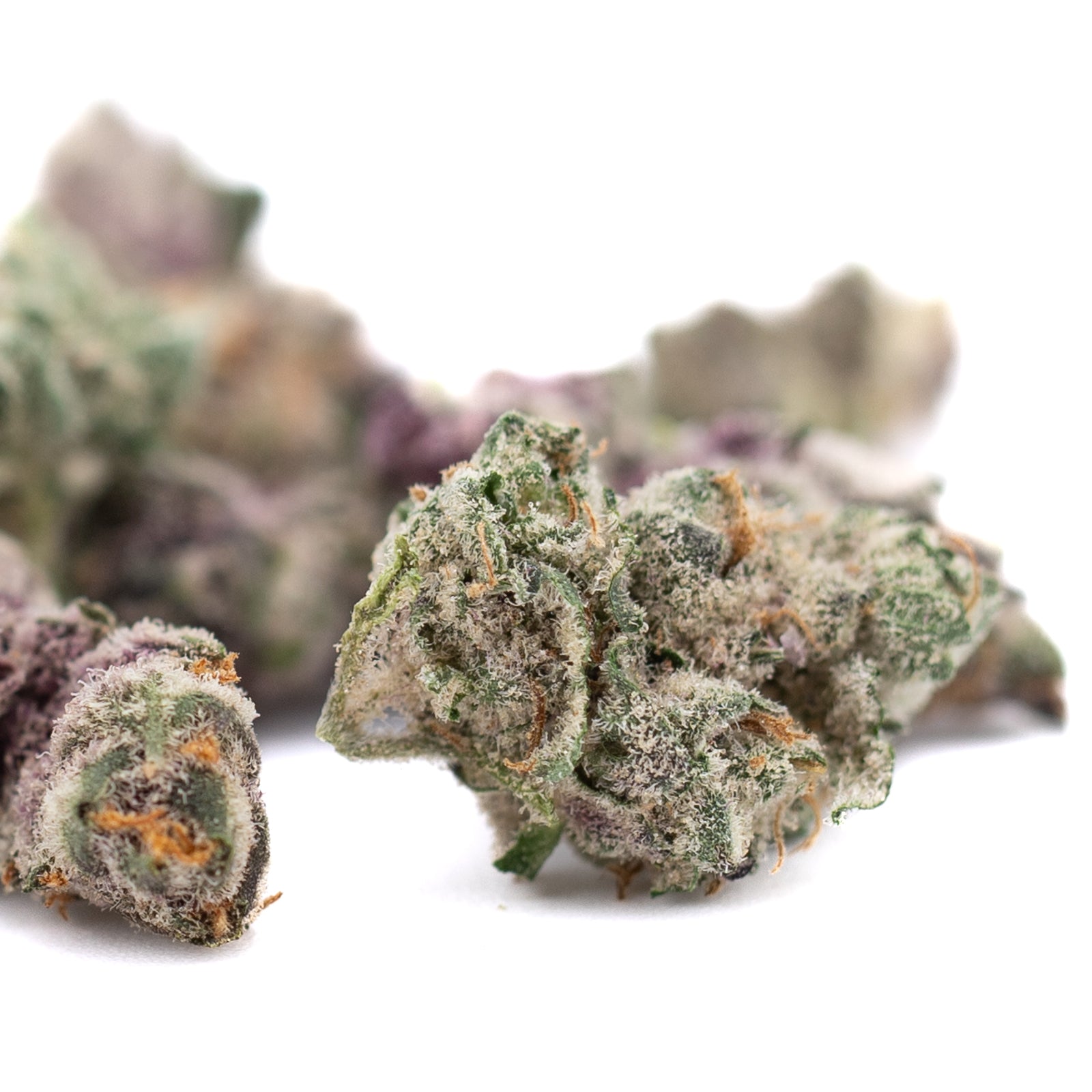 Close-up of Dark Jokerz THCa Flower Smalls with dense trichomes and vibrant purple hues