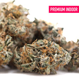 Premium dea-4 indoor thca flower buds with dense frosty green and orange hues for maximum therapeutic depth