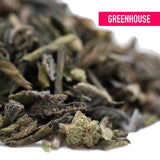 A pile of dried curly green deep chunk tea leaves with fuzzy texture known for romulan x deep sedative effects