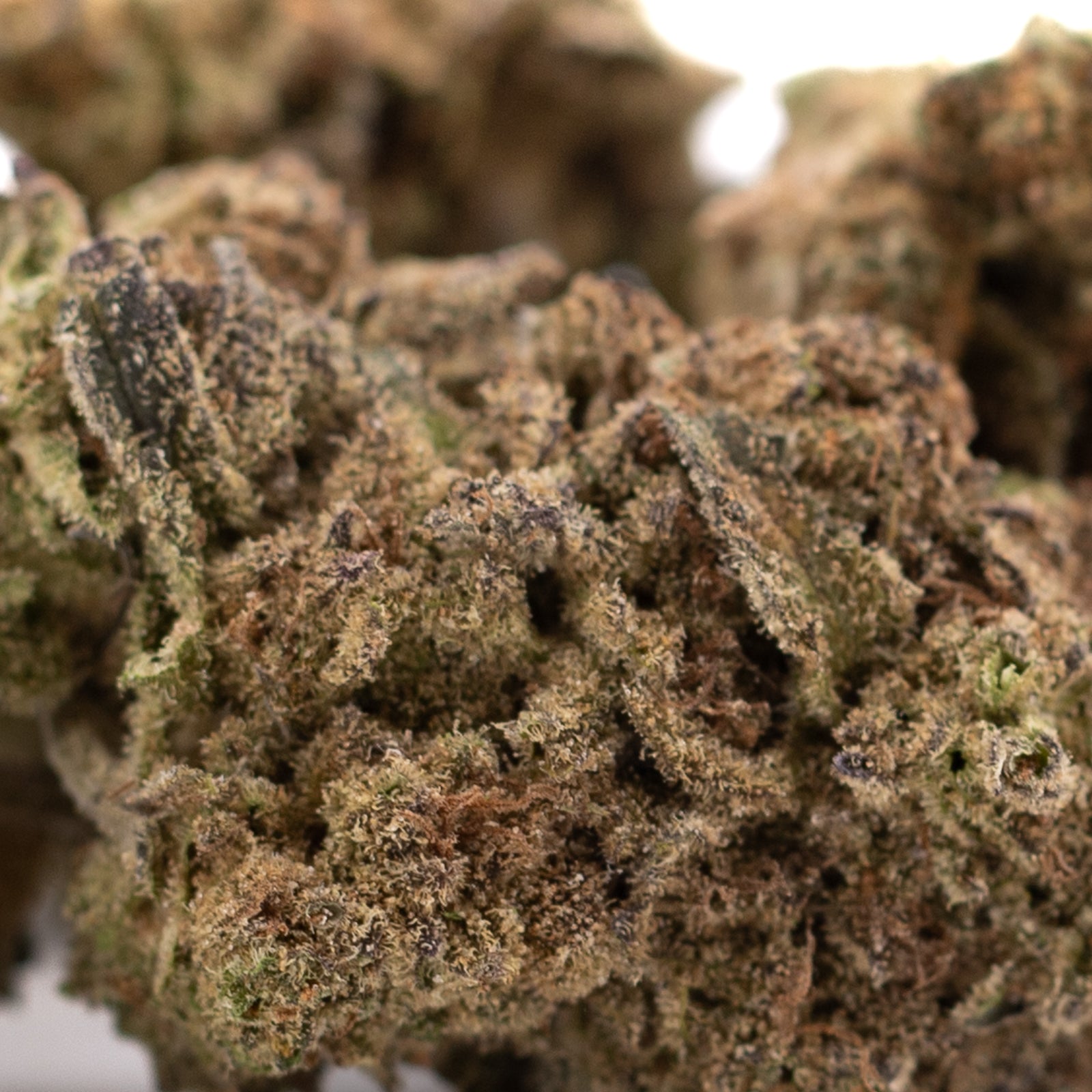 Deep Space THCa hemp flower bud with green hues and trichomes