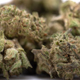 Green and brown deep space hemp flower buds with dense frosty texture featuring knockout genetics greenhouse smalls