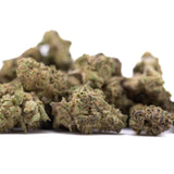 A pile of deep space hemp flower greenhouse smalls with knockout genetics showing green and brown buds covered in trichomes