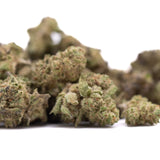 A pile of deep space hemp flower greenhouse smalls with frosty green buds and purple and brown trichomes showcasing knockout genetics