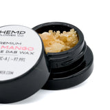 Open jar of Dosi Mango THCA Crumble Wax with pale yellow hemp flower concentrate