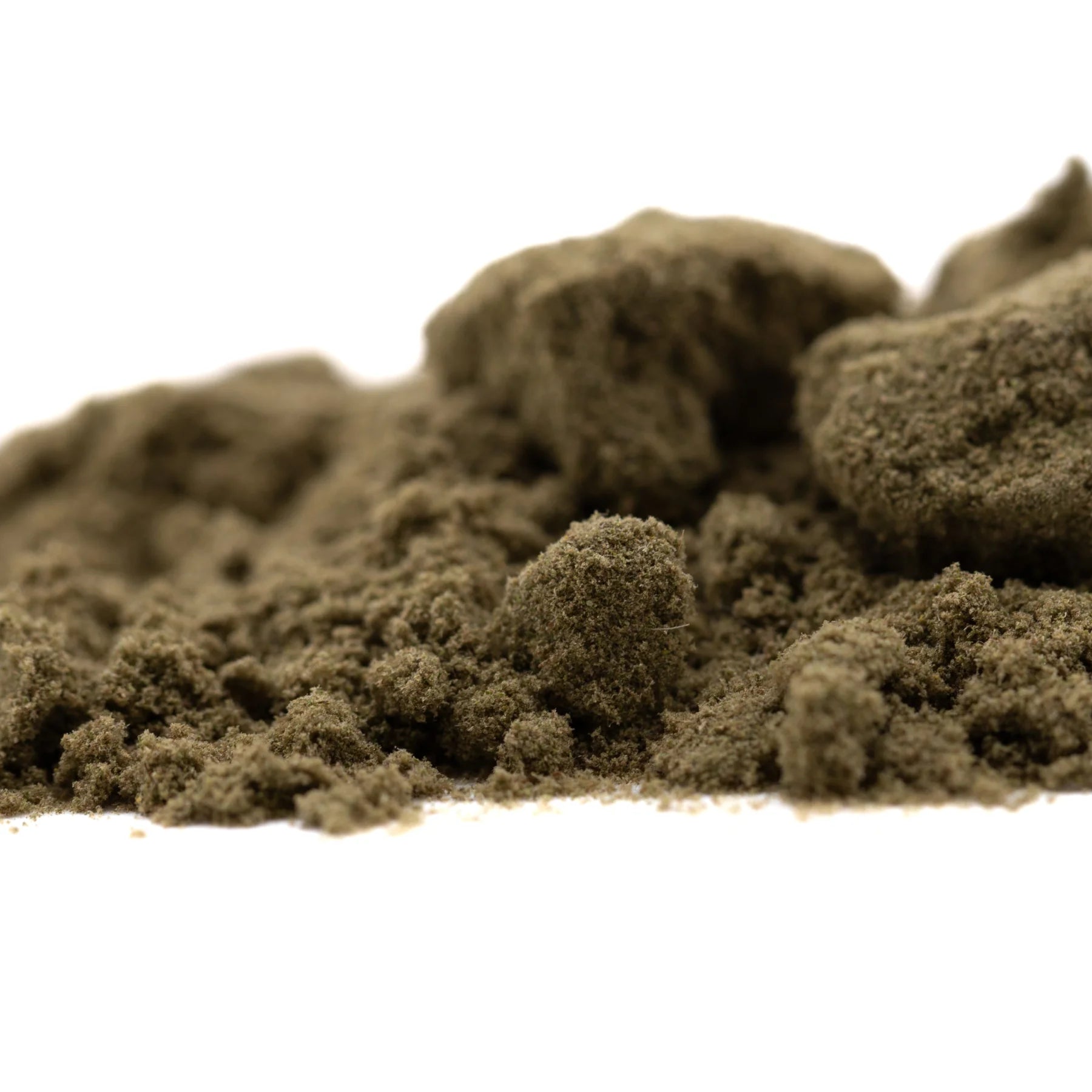 A mound of earthy brown thca kief with a granular texture from durban poison living cannabis full-term product